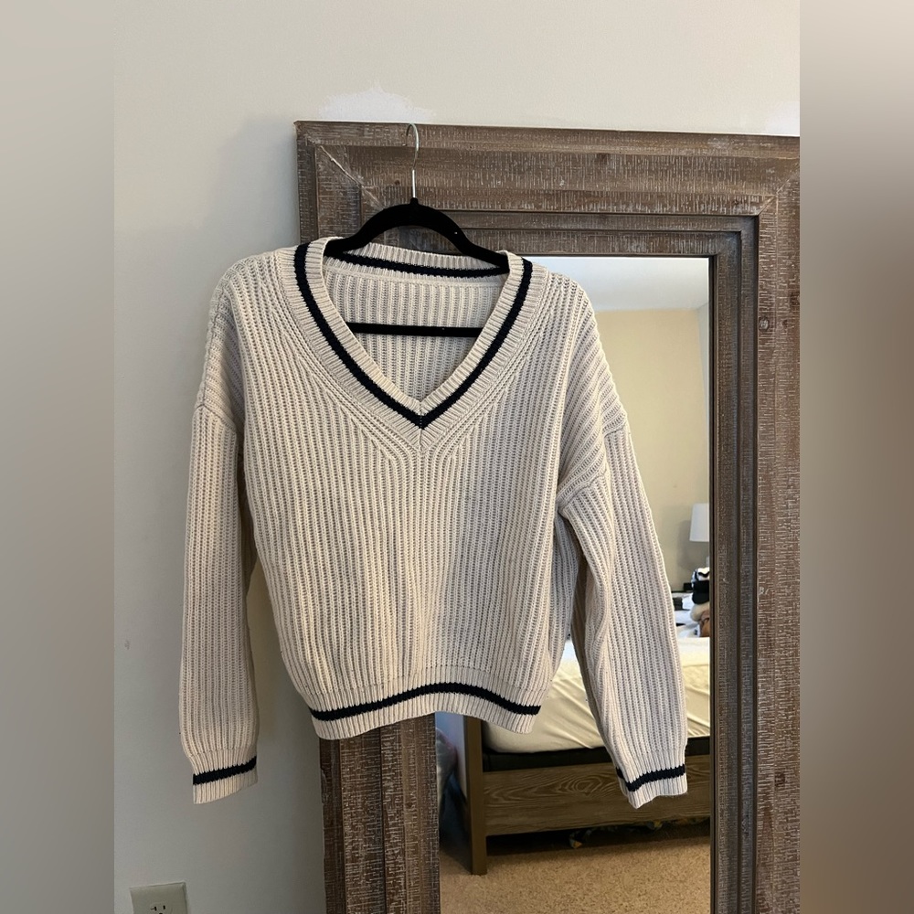 Cream knit sweater with navy blue v neck detailing. Size small from SHEIN